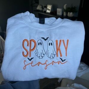 Embroidered G ildan White Sweatshirt with Orange 'Spooky Season' Design